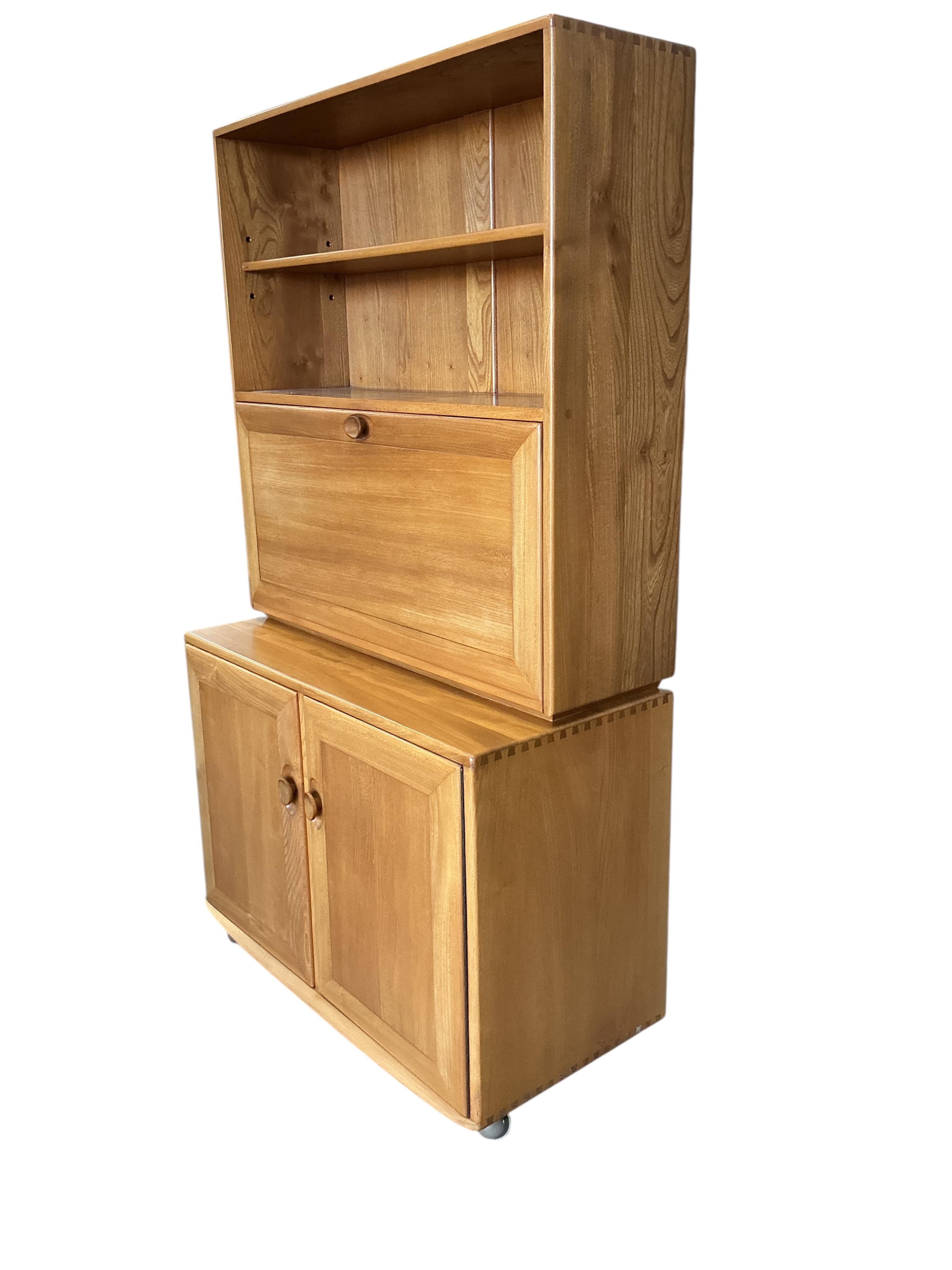 An Ercol Windsor light elm writing cabinet, width 91cm, depth 45cm, height 163cm